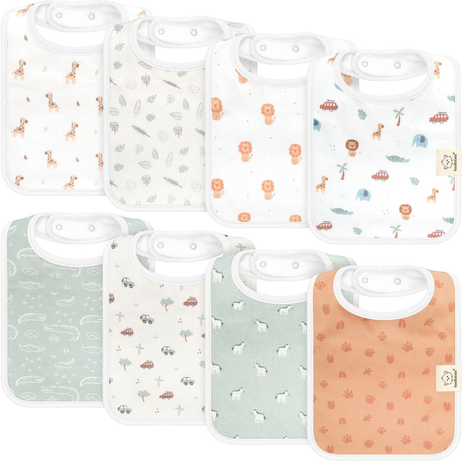 A set of eight baby bibs in soft pastel colors with playful safari and adventure-themed prints, featuring animals, trees, and vehicles, designed for both function and style.