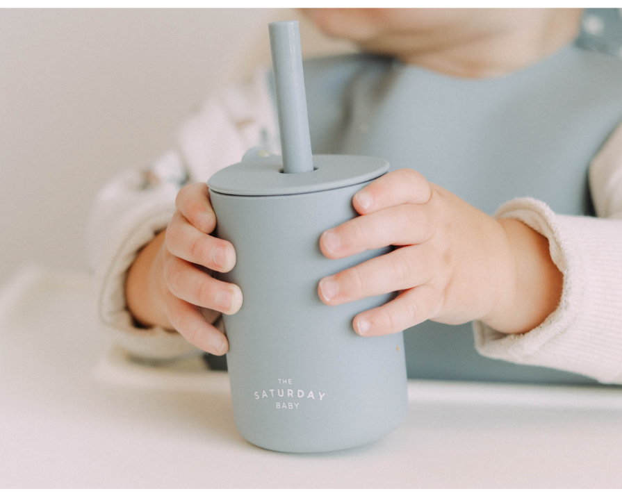 Child holding a light blue sippy cup with promotional text overlay for 'Hangry Bae Bundle'.