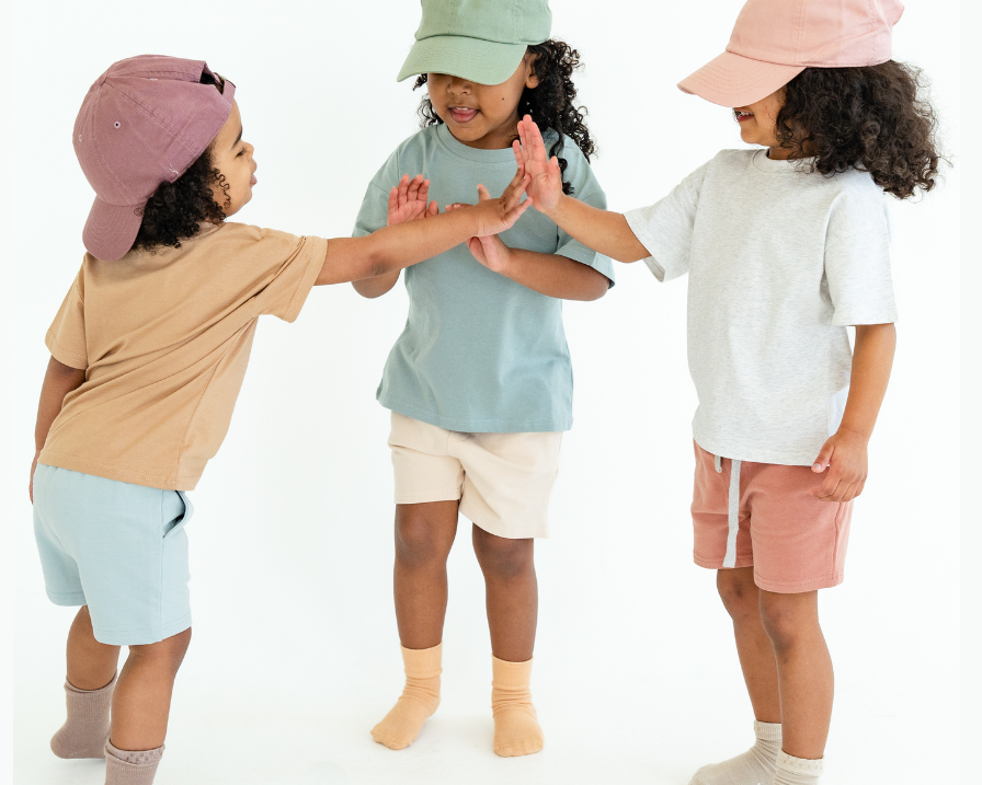 Children wearing colorful tees and hats with a Black Friday sale text overlay on a white background.