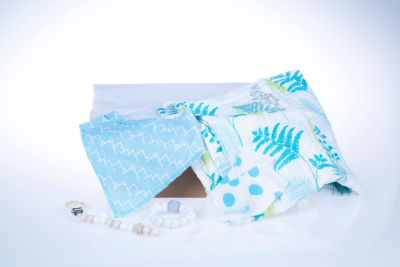 Gift box that includes one bib, muslin swaddle, pacifier clip, teether and infant sock.